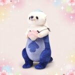 Une peluche loutre Youyou inspirée du jeu vidéo Genshin Impact, debout sur fond pastel avec des étoiles et des fleurs, tenant un petit cœur rose entre ses pattes.