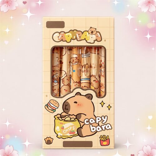 Un stylo Kawaii capybara effaçable à encre bleue dans une boîte décorée, avec un dessin de capybara mignon et des motifs colorés.
