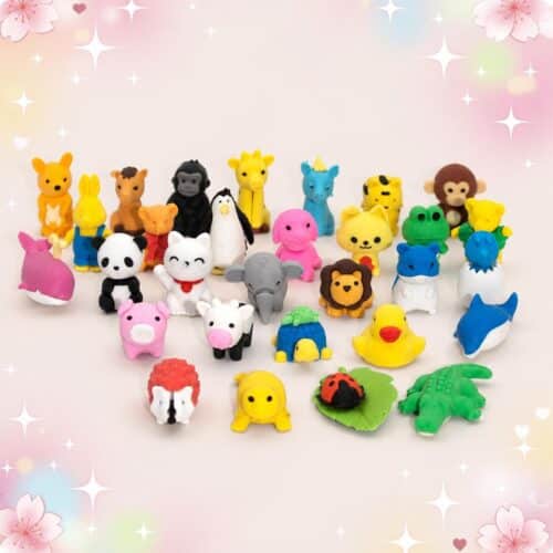 Un lot de Gomme Kawaii aux motifs animaux colorés variés, avec de petites gommes en forme d’animaux mignons de toutes les couleurs, posées sur un fond rose décoré d’étoiles et de fleurs.