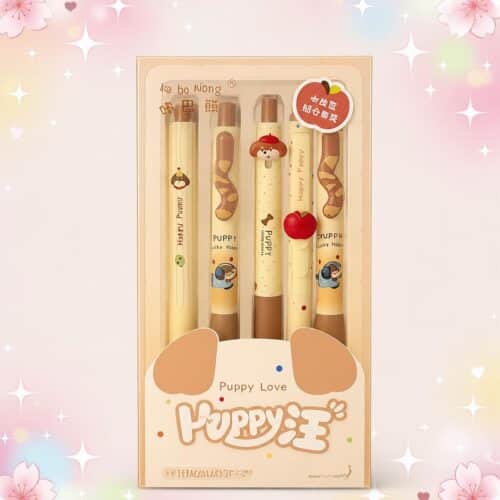Un coffret rose et beige contenant le stylo Kawaii chiot présenté dans un joli coffret, avec plusieurs stylos décorés de petits chiots.