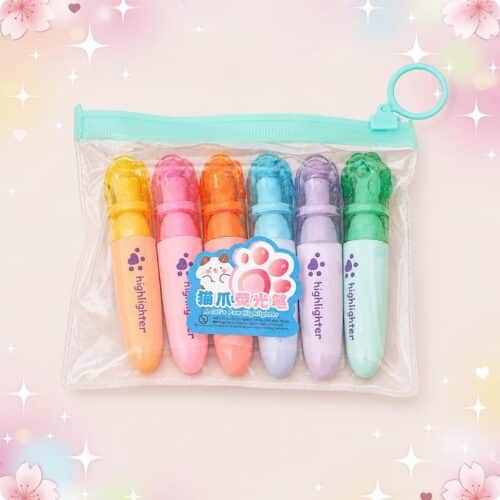 Un lot de 2 paquets de feutres Kawaii longue durée dans une trousse transparente, avec six couleurs pastels et un style mignon en forme de patte de chat.