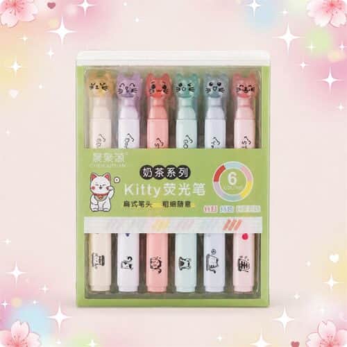 Un lot de 2 paquets de feutres Kawaii teintes lactées, dans une boîte verte avec 12 feutres pastels à têtes de petits chats, sur un fond rose doux et brillant.