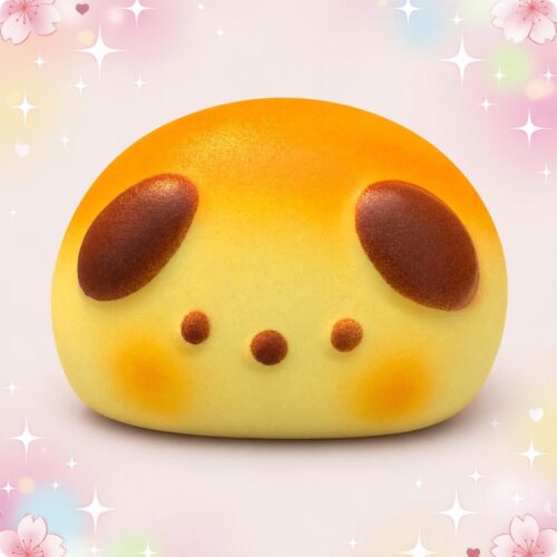 Un jouet anti-stress squishy en forme de tête de chiot jaune et doux, avec de grosses oreilles marron et de petites joues rondes, posé sur un fond rose décoré d’étoiles.
