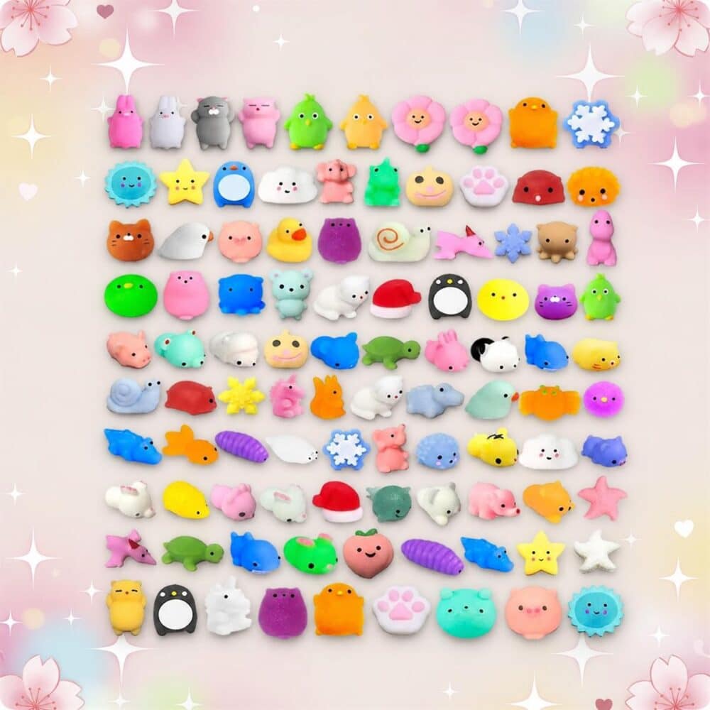 Un lot de 100 jouets mochi squishy anti-stress colorés en forme d’animaux et d’étoiles, alignés sur un fond pastel rose.