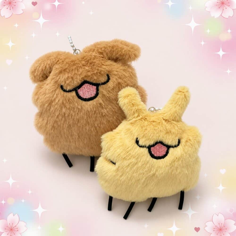 Deux porte-clés en peluche du duo de porte-clés peluche Lost Fleas de Hollow Knight Silksong, l’un brun et l’autre jaune, avec de petites pattes noires, sur un fond pastel décoré de fleurs et d’étoiles.